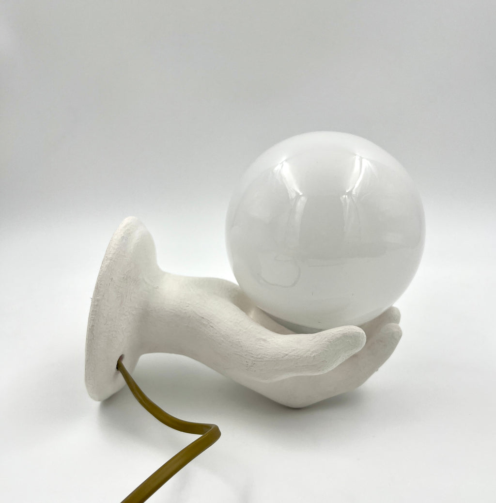 Vintage hand wall lamp with glass globe – sculptural design