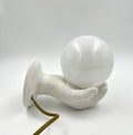 Vintage hand wall lamp with glass globe – sculptural design