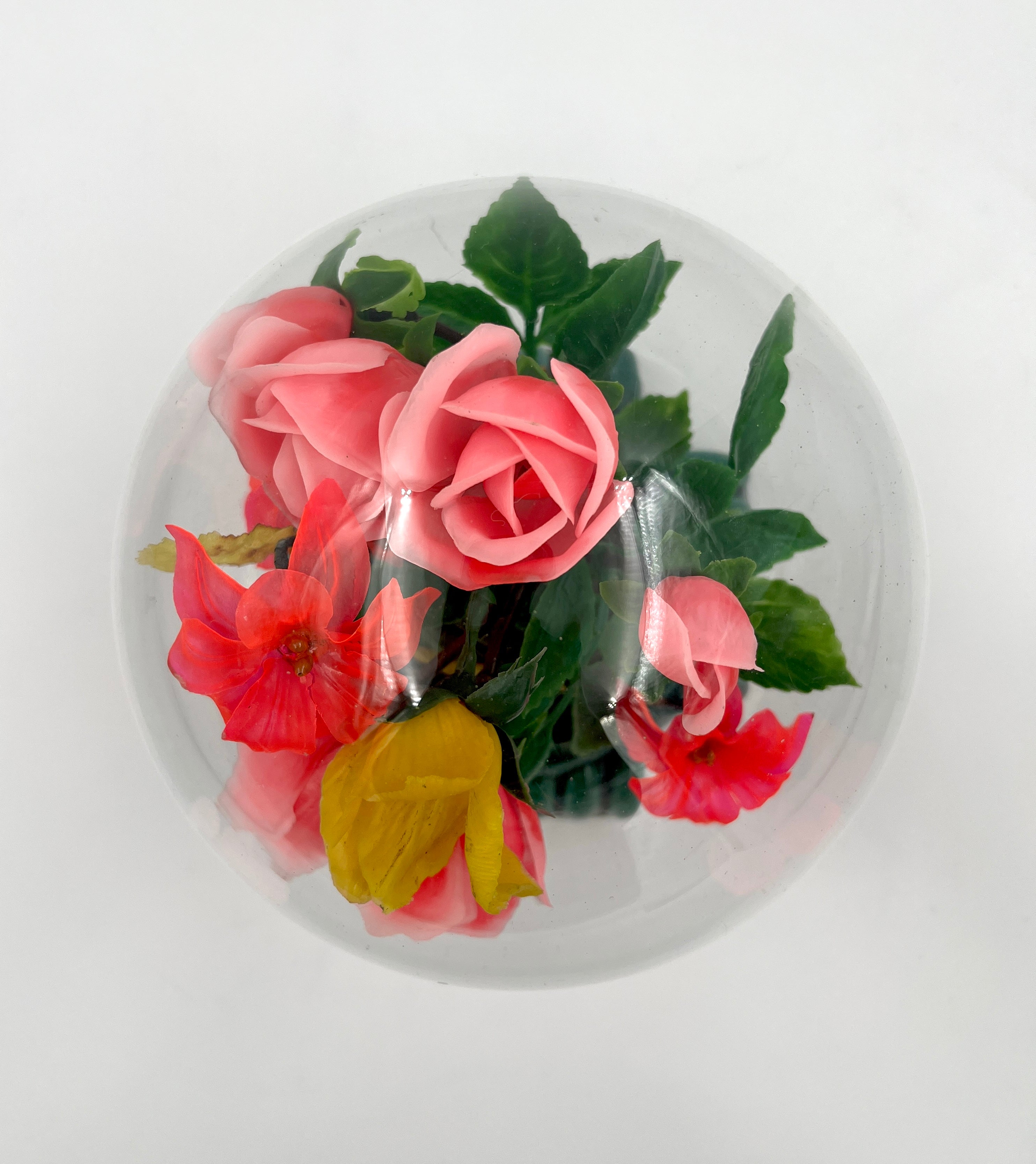 Le Rosarium France Decorative vintage floral arrangement under a clear glass dome with a glossy green base