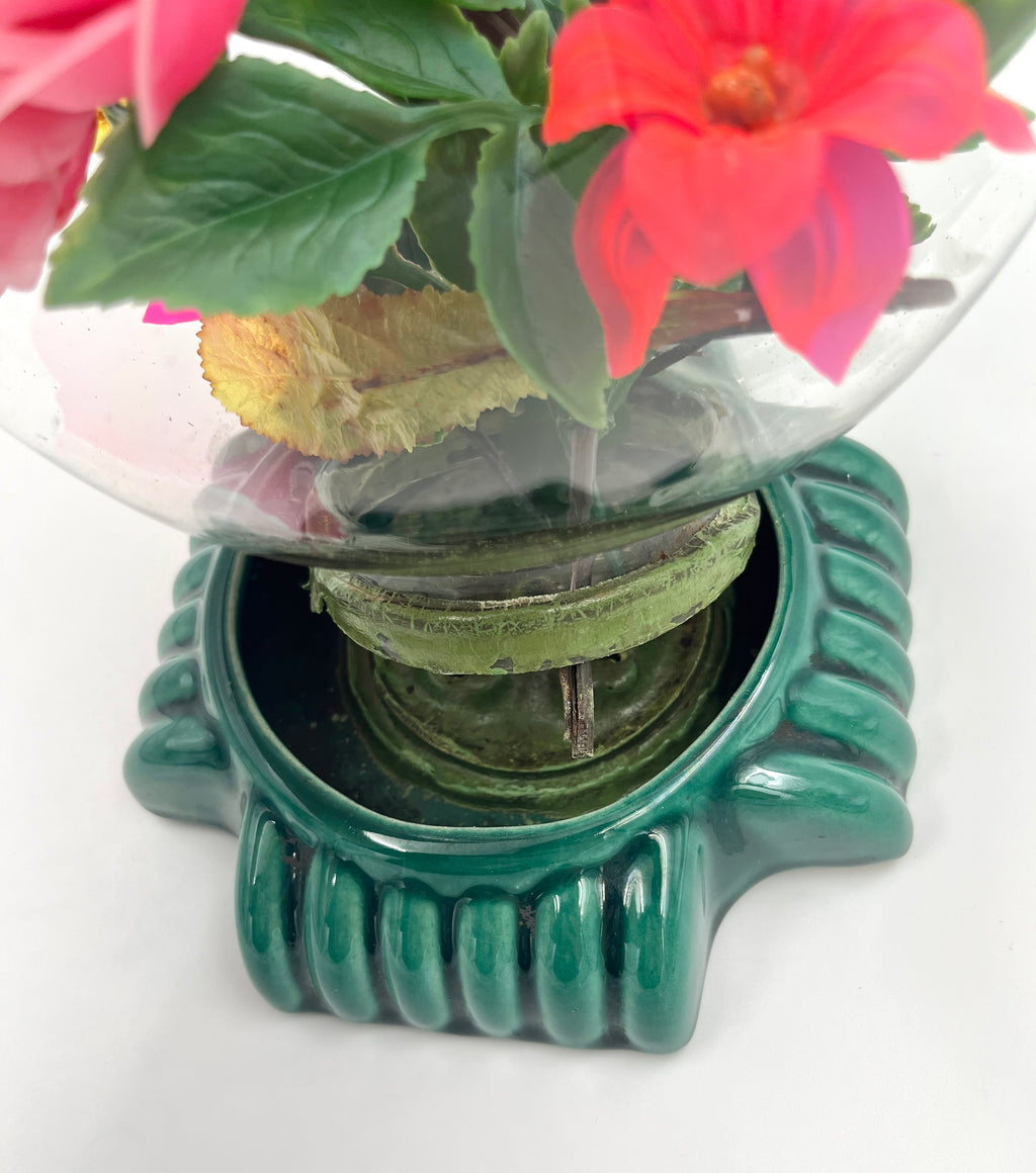 Le Rosarium France Decorative vintage floral arrangement under a clear glass dome with a glossy green base