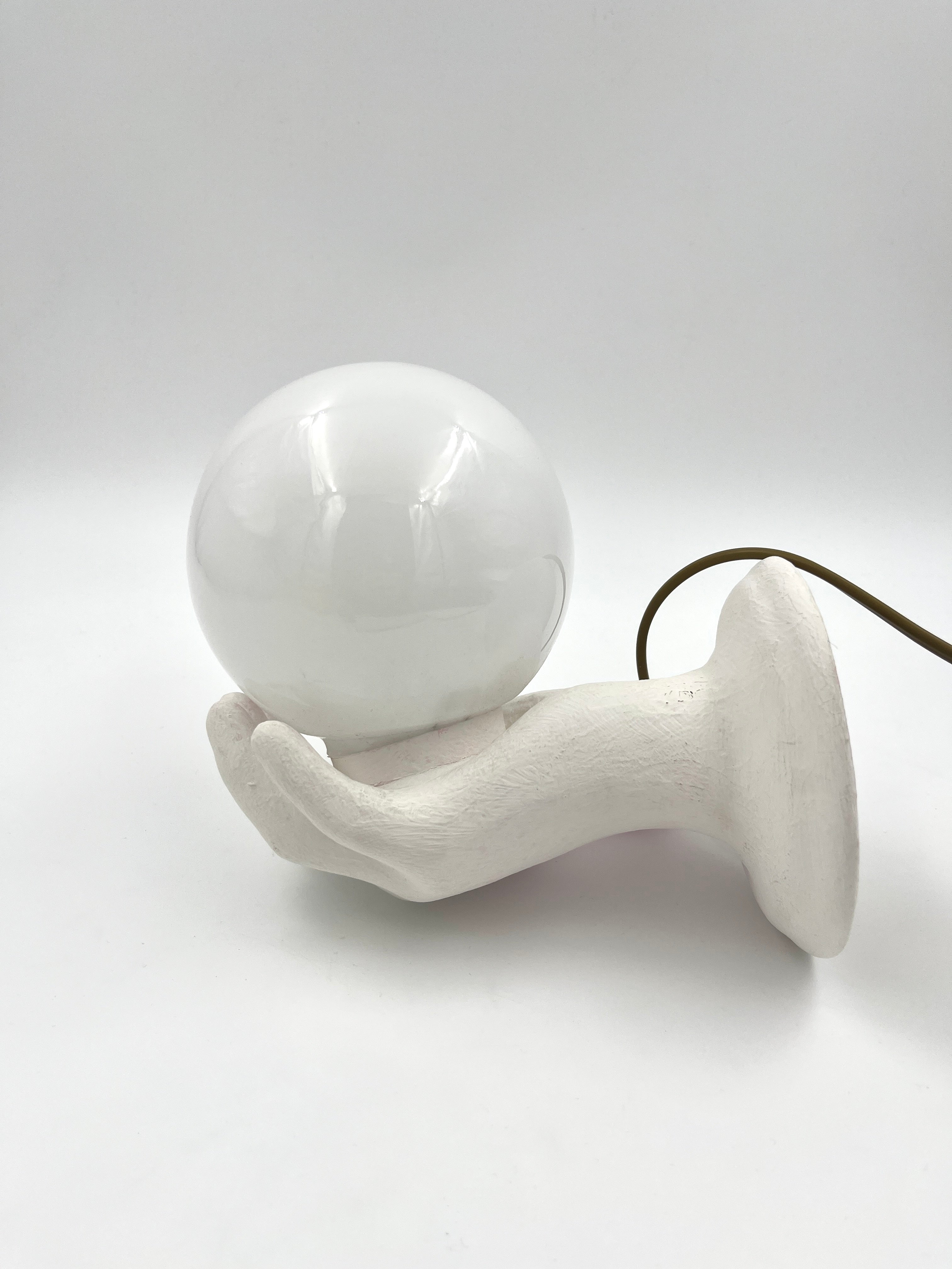 Vintage hand wall lamp with glass globe – sculptural design