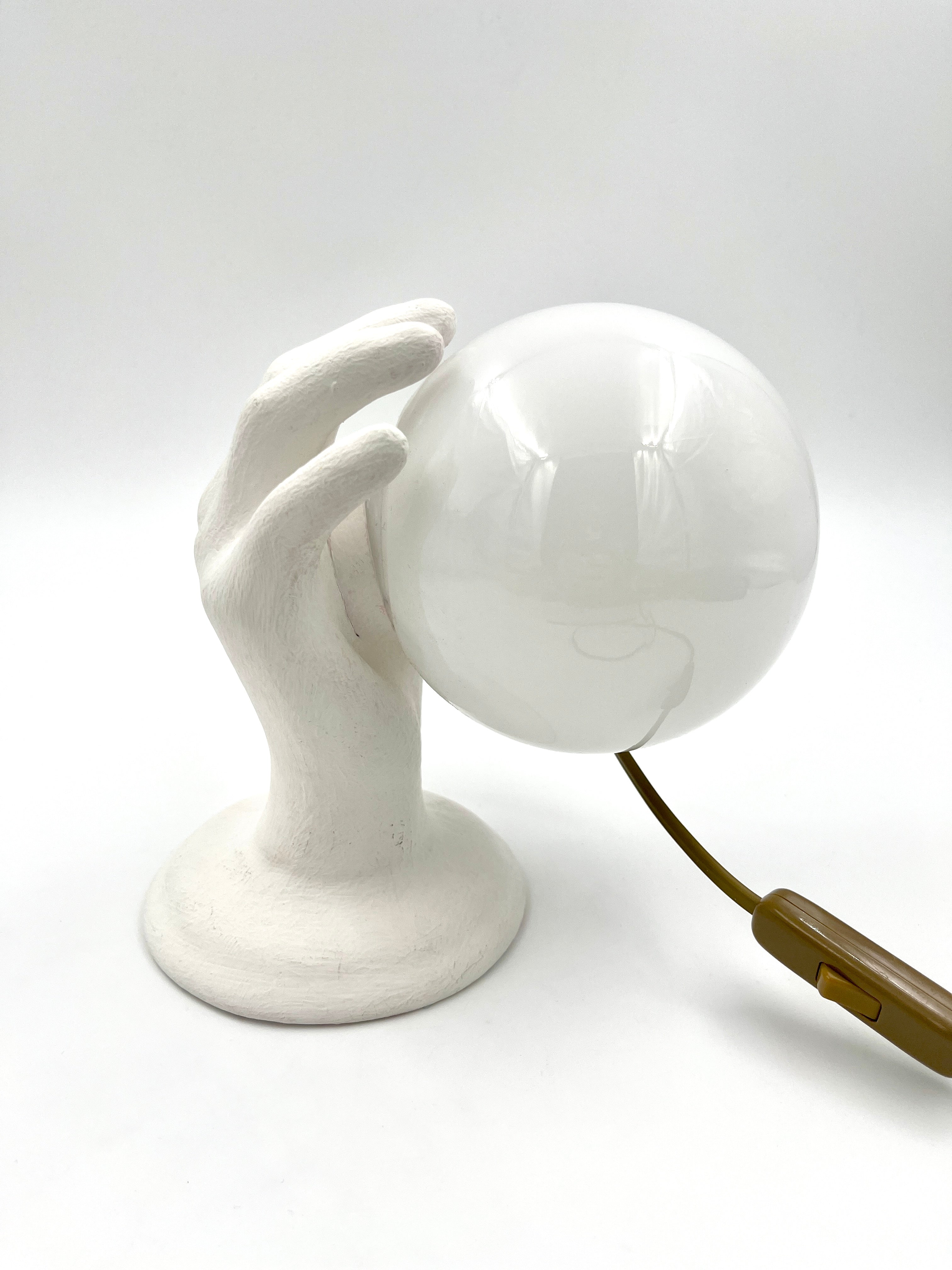 Vintage hand wall lamp with glass globe – sculptural design